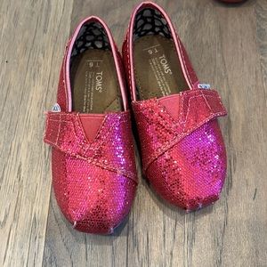 One pair of Toms glitter shoes
